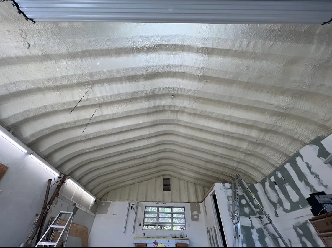Spray polyurethane foam applied to the underside of a metal roof deck in Swannanoa
